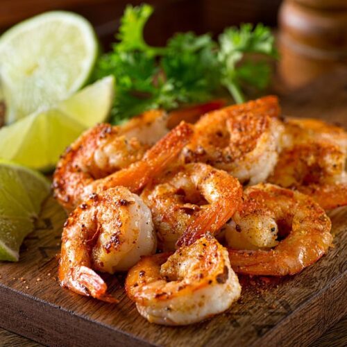 Delicious sauteed shrimp with cajun seasoning and lime on a maple plank. KERALI RESTAURANT & BAR